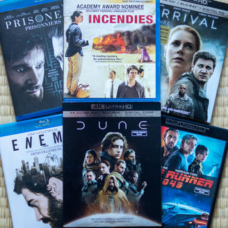 Boîtiers de six films réalisés par Denis Villeneuve : Prisonniers, Incendies, L'arrivée, Ennemi, Dune première partie et Blade Runner 2049.