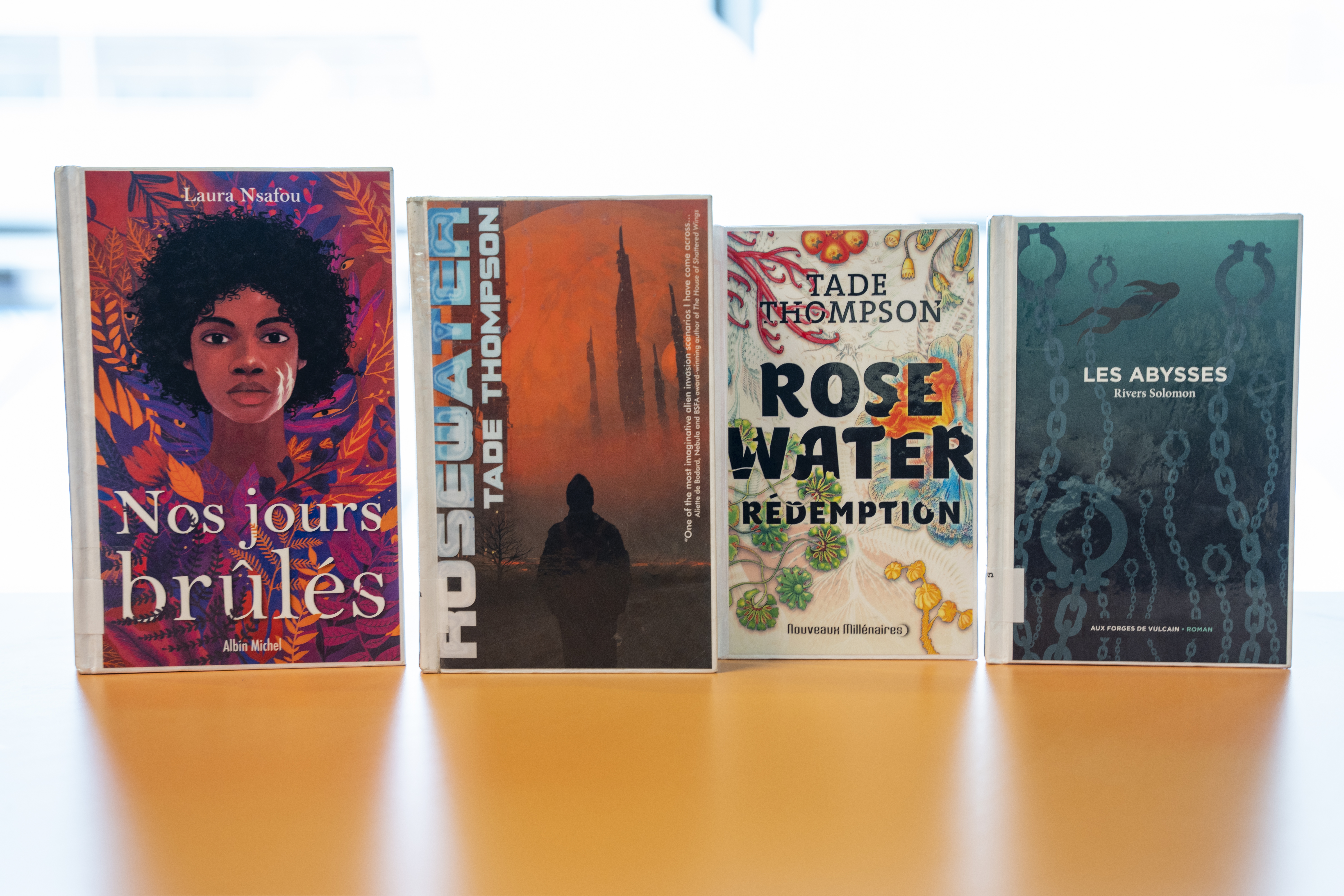 Couvertures des livres Nos jours brûlés, Rosewater, Rosewater rédemption et Les abysses.
