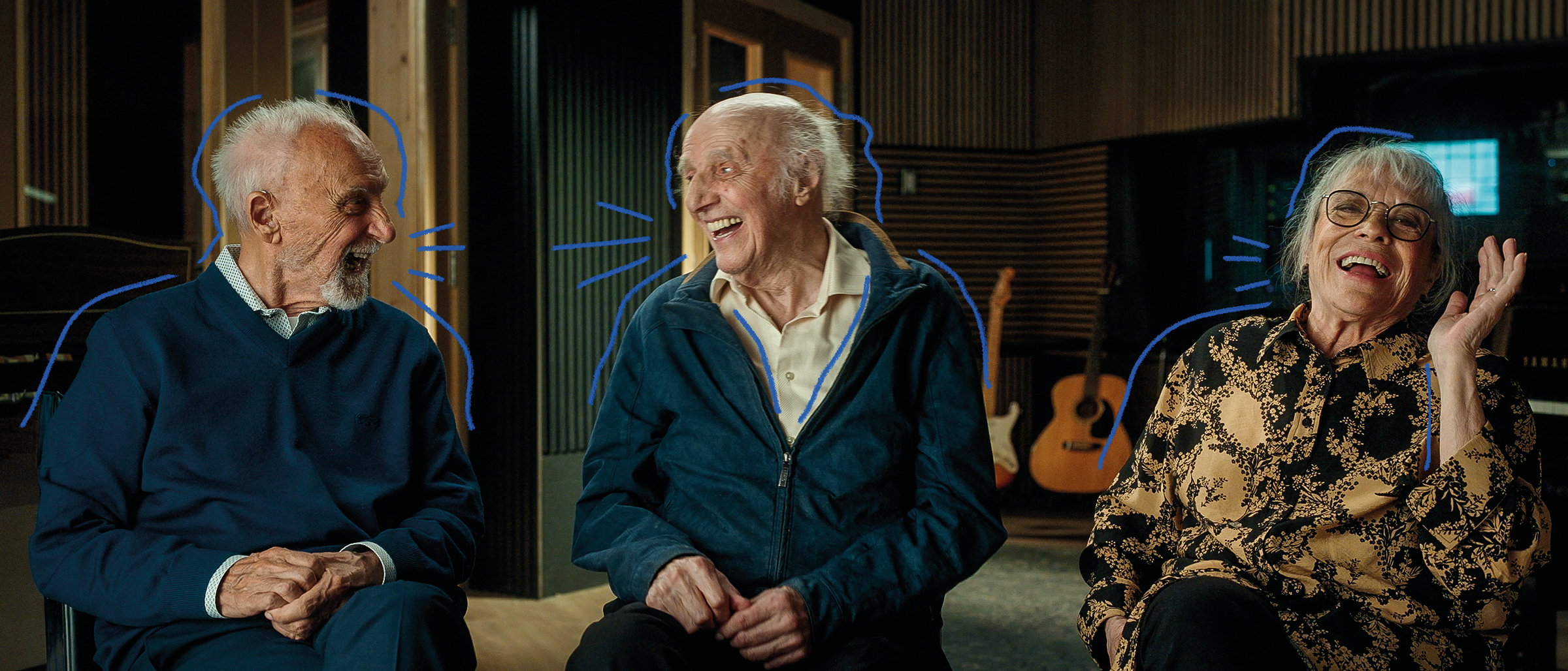 Yvon Deschamps, Gilles Vigneault et Louise Forestier ensemble en train de rire dans un studio de musique